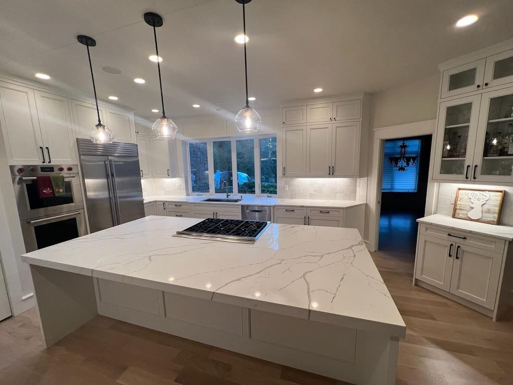 a beautiful kitchen with a granite counter top